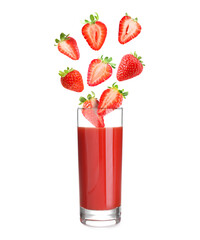 Freshly made strawberry juice on white background. Cut and whole berries falling into glass