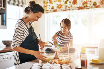 Mother, cooking or happy girl baking in kitchen as a family with a young kid learning cookies recipe at home. Cake pastry, baker or mother helping or teaching daughter to bake for child development - Powered by Adobe