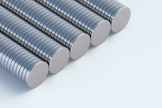 Many neodymium magnets on white background. Copy space. 3d render