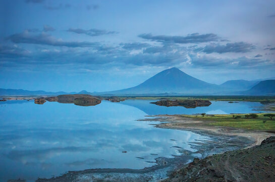 Lake Natron and sacred Masai volcano Ol Doinyo Lengai at dusk. Tanzania