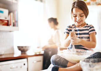Obraz na płótnie Canvas Messy, happy and child baking in the kitchen with parent for bonding, food and dessert. Funny young girl mixing flour in a bowl with chaos, energy or cooking with happiness while playing for learning
