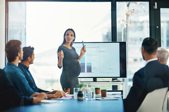 Pregnant, business woman and presentation at a teamwork workshop with speech and communication. Manager, female speaker and company learning with staff and boss with sales graph strategy in office - Powered by Adobe