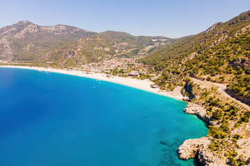 Fototapeta na wymiar Oludeniz resort village on Aegean sea coast in Turkey, aerial wide shot