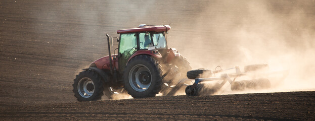 Tilling the soil: a tractor cultivator in action