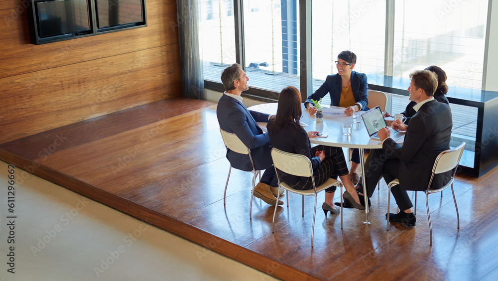 Poster Professional, group and meeting for a discussion or collaboration at a company with a plan. Teamwork, conversation and strategy at a table for a project or partnership with tech at the office.