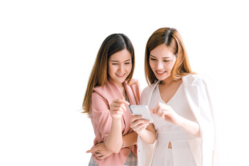 Two Asian business women looking at the smartphone screen using smart phone for online shopping, internet. isolated white background, remove background