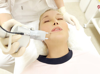 Fototapeta premium Laser Treatment,Cosmetic Laser Dermatology ,dermatologist offices,laser technology