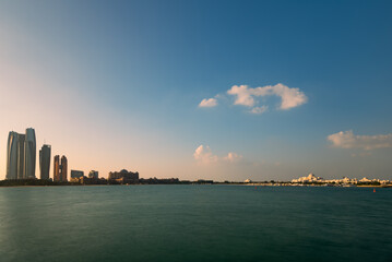 Fototapeta premium Sunrise high rise building of hotel, offices in Abu Dhabi capital, United Arab Emirates