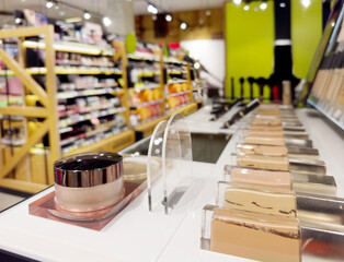 buying make up at cosmetics section in store. choosing cosmetics, perfumes, creams and shampoos, Using tester.