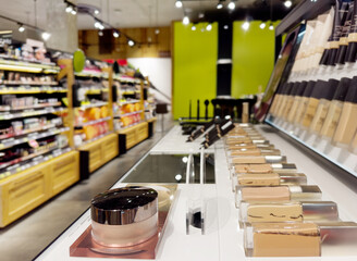 buying make up at cosmetics section in store. choosing cosmetics, perfumes, creams and shampoos, Using tester.