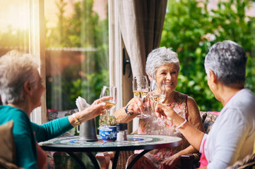 Cheers, wine glasses and senior women or friends in retirement, reunion or social celebration, success and happy. Champagne, celebrate and elderly people or customer toast, restaurant and hospitality
