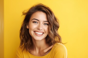 Close-up portrait photography of a satisfied girl in her 20s smiling against a yellow background. With generative AI technology