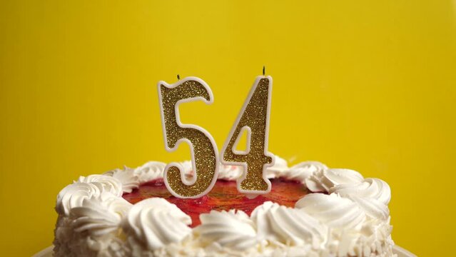 They blow out a candle in the form of the number 54, which is stuck into the holiday cake. Celebrating a birthday or a landmark event. The climax of the celebration.
