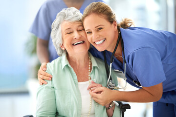 Nurse, senior woman and hug of caregiver and happy smile with support and care in hospital. Wheelchair, women and healthcare employee help with elderly female patient with love in a health clinic - obrazy, fototapety, plakaty