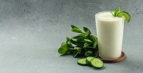 Fresh asian yogurt drink kefir, ayran on a light background. Long banner format. top view