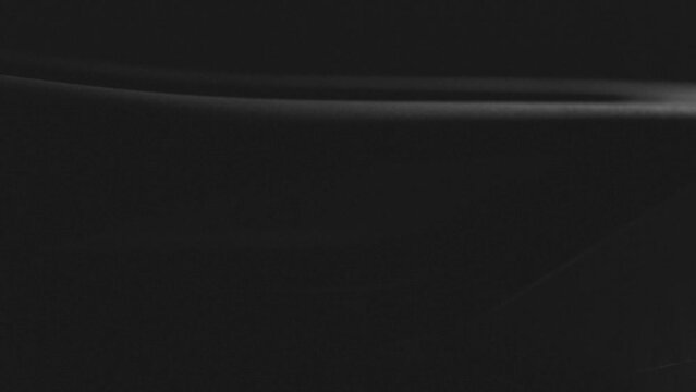 Black carbon road bicycle saddle on dark reflective background