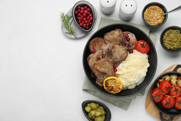 Tasty beef tongue pieces, berries, mashed potatoes and ingredients on white table, flat lay. Space for text