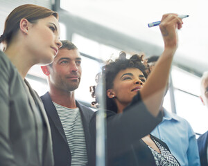 Woman, writing and glass with business people in group for strategy, planning and collaboration in...