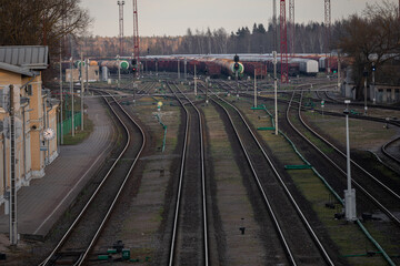 Railway Network In Lithuania. Radviliskis is well known railway capital in Lithuania. Beautiful evening sunset light and cars in background.