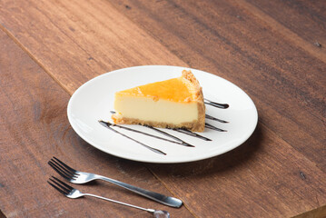 Cheese cake with dark wood background