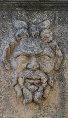 ancient stone carving of mythical man located at Roman forum in Zadar, Croatia