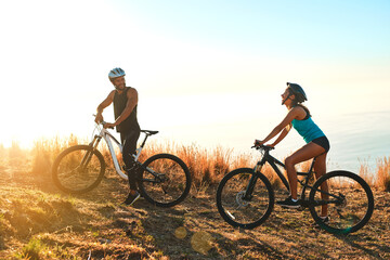 Obraz na płótnie Canvas Happy couple, workout and cycling in the mountains for fitness and exercise together. Bike, wellness and young people with outdoor adventure and sports training with happiness and freedom mockup