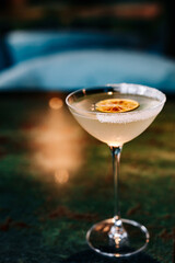 alcoholic cocktail in a glass stands on a table in a bar or restaurant