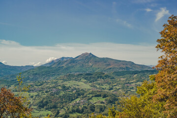 Mount Ventasso seen from Pietra di Bismantova in the typical landscape of the Parmigiano-Reggiano (parmesan) cheese production areas. Reggio Emilia province, Emilia Romagna, Italy