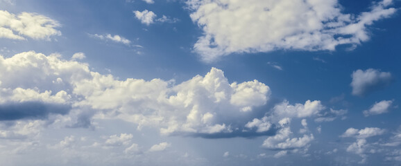 A lovely blue sky with white fluffy clouds