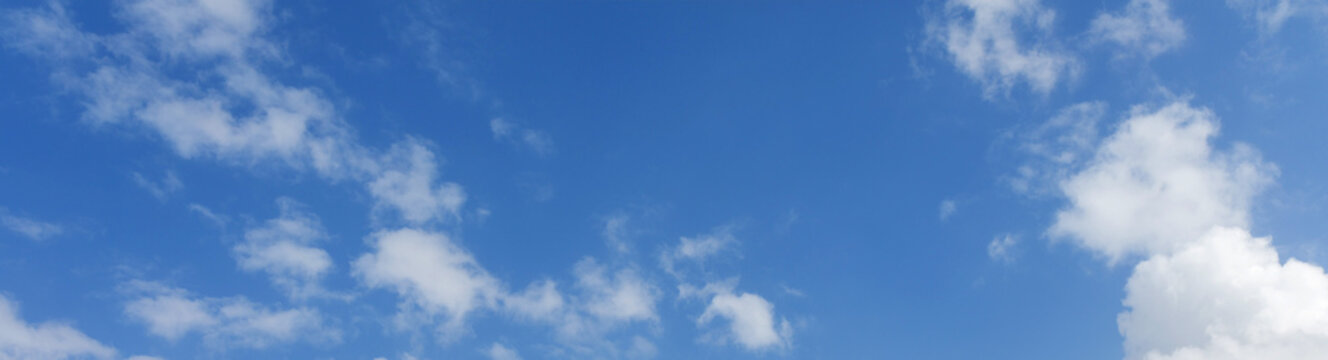 A lovely blue sky with white fluffy clouds