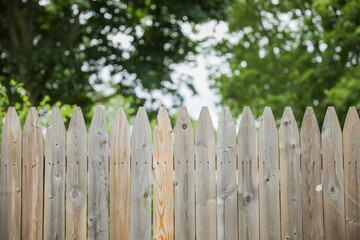 Wooden fence represents boundaries, security, privacy, natural beauty, rustic charm, and a connection to nature