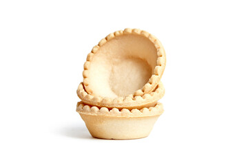 Tartlet shells isolated on white background. Three empty mini tart shells for portable desserts