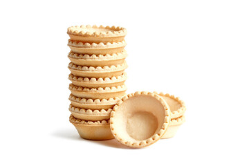 Tartlet shells isolated on white background. Stacked empty mini tart shells for portable desserts