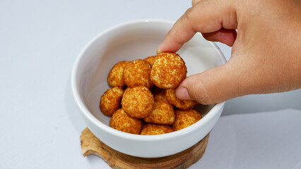 Palm sugar cookies on a white bowl, in bright mood. Round cookies coating with palm sugar.