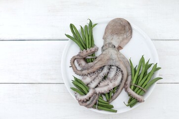 Octopus and green beans, seafood, on the table, white background, background image, wallpaper