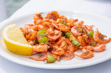 Plateful of Fried Shrimp Served with a Wedge of Lemon in a Restaurant in Symi Greece