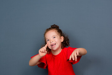 Beautiful and happy girl making hand gestures.