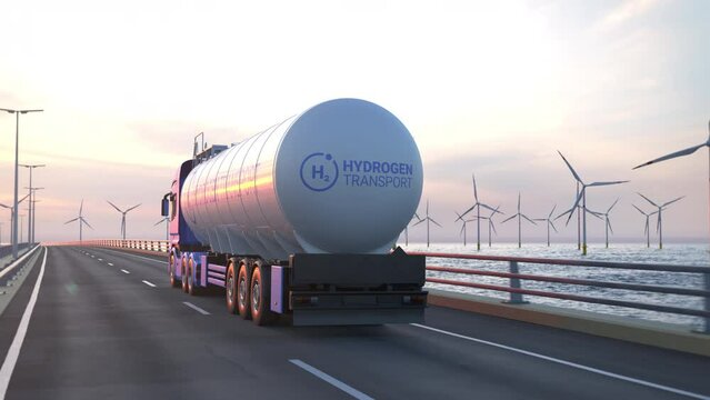 Generic electric semi truck with hydrogen tank trailer driving along a bridge or coastal road into the sunset with wind turbines in background. Green energy concept. Realistic 3d rendering animation.