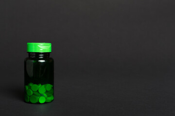 Plastic bottle for vitamins on color background