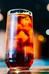 alcoholic cocktail in a glass stands on a table in a bar or restaurant