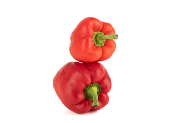 Ripe sweet red peppers isolated on white background.