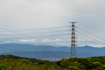 High voltage tower with blue sky background