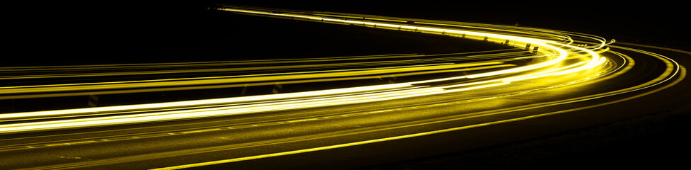 yellow car lights at night. long exposure