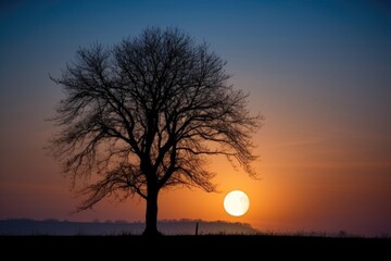 moon setting behind silhouetted tree, with sunrise in the distance, created with generative ai