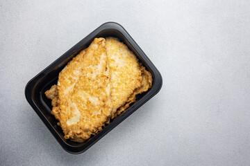 Delicious meat dishes in a black box. Delivery