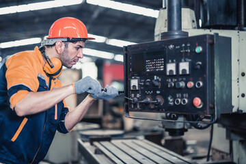 Skilled mechanical technicians tighten, loosen components with screwdriver to perform safety...