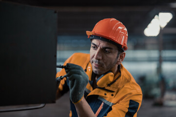 Skilled mechanical technicians tighten, loosen components with screwdriver to perform safety...