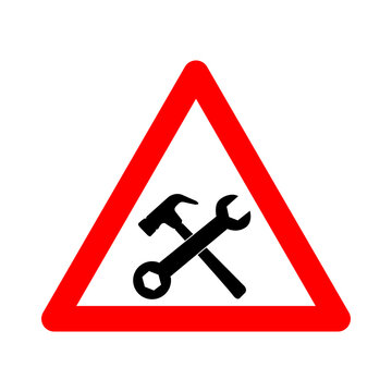 Under construction sign. Warning sign workshop. Red triangle sign with crossed hammer and wrench icon inside. Caution at the construction site. Workers, machinery and other obstacles.