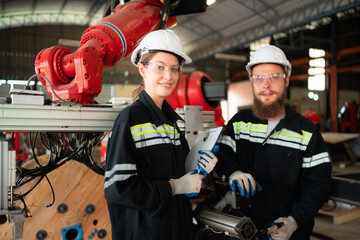 Portrait of Electrical engineer with the mission of installing a robot arm electrical system