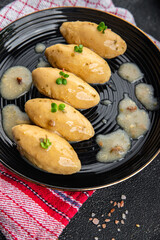 fish quenelles white sauce meal food snack on the table copy space food background rustic top view